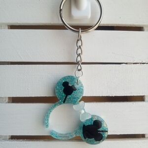 Glittery Blue Keychain with Black Silhouette